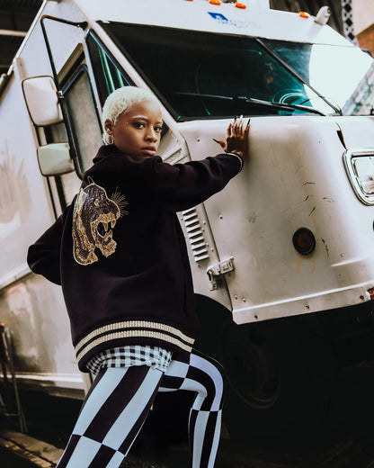 A.I.9 AFRICAN INTELLIGENCE GUILDED LEOPARD - SANDFLOWER COLLAB VARSITY
